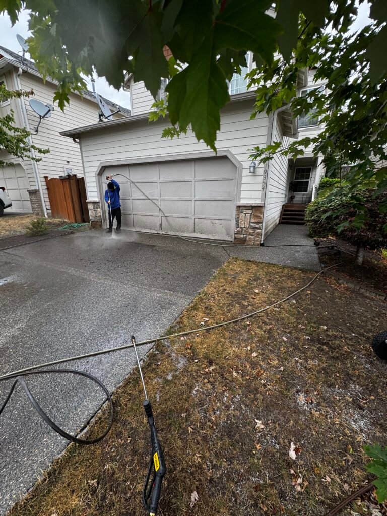 Pressure washing a driveway
